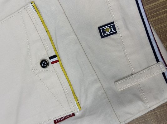 XMAMLON RTSのカキ色の男性用服装用綿パンツ
